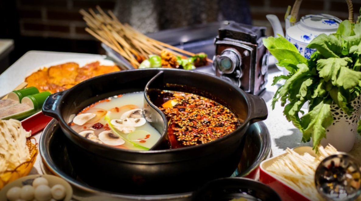 Split hot pot with skewers and vegetables