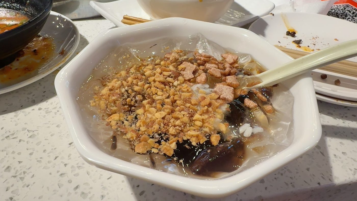 A bowl of dessert at the table